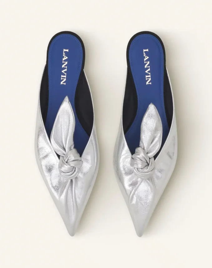 Mule Midnight Step con fiocco in pelle metallizzata Mule Midnight Step con fiocco in pelle metallizzata